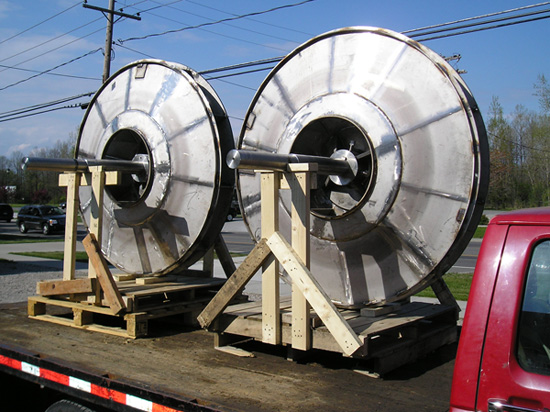 Two 65” diam. Buffalo HT Fan replacement 3xxSS/AL6XN alloy fan wheels and shafts ready for emergency delivery to a major North American paper plant.