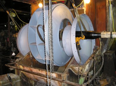 Turnkey installation of a large boiler ID fan replacement rotor assembly and inlet cones.